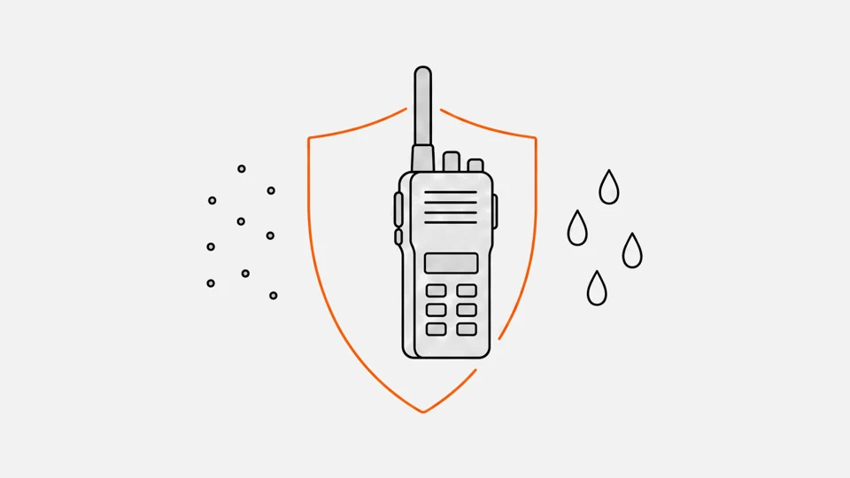 A rugged radio in front of a shield, with dust on one side and water drops on the other